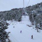 Skiers on Bosc Fosc blue run from Planell de la Font chairlift
